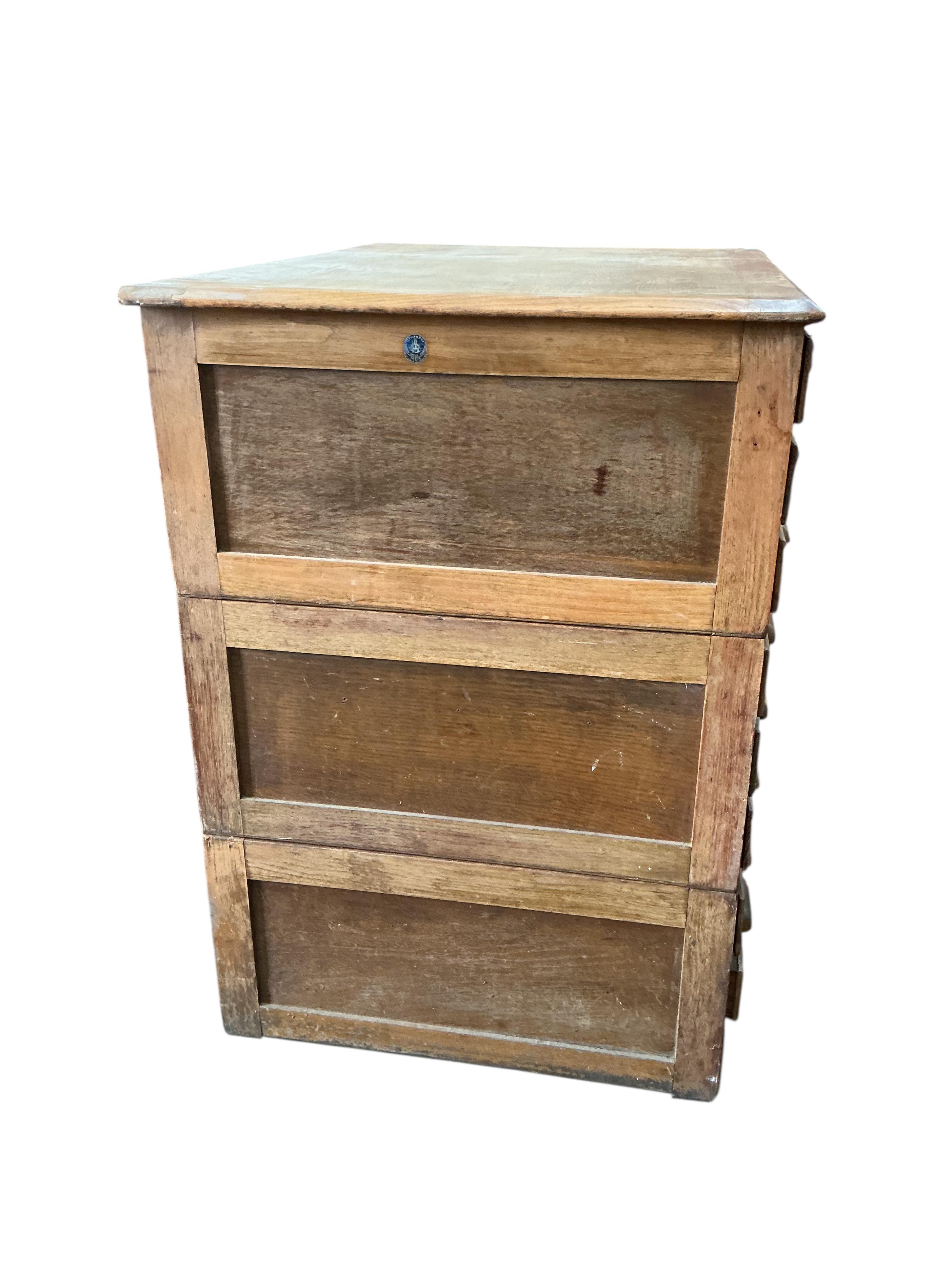 A mid century oak three section plan chest, width 117cm, depth 84cm, height 120cm